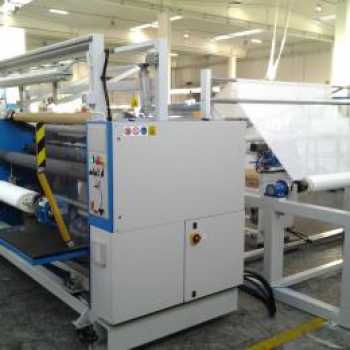 INSPECTION MACHINE AND FABRIC CUTTING
