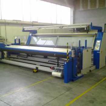 INSPECTING  AND ROLLING MACHINE WITH LONGITUDINAL CUTTING SYSTEM.
